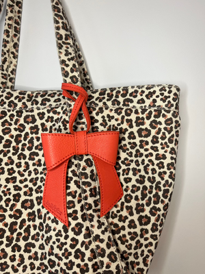 
                  
                    Load image into Gallery viewer, MINERVA Bow Bag Charm - Coral Leather
                  
                