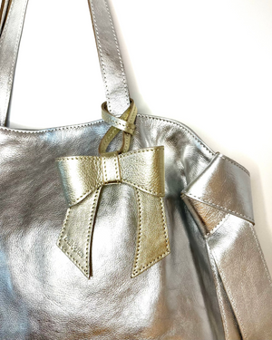 
                  
                    Load image into Gallery viewer, MINERVA Bow Bag Charm - Gold Leather
                  
                