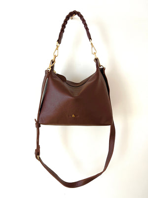 
                  
                    Load image into Gallery viewer, Brown leather handbag with a braided handle on a white background
                  
                