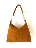tan suede crossbody bag with braided handle