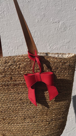 
                  
                    Load and play video in Gallery viewer, MINERVA Bow Bag Charm - Coral Leather
                  
                